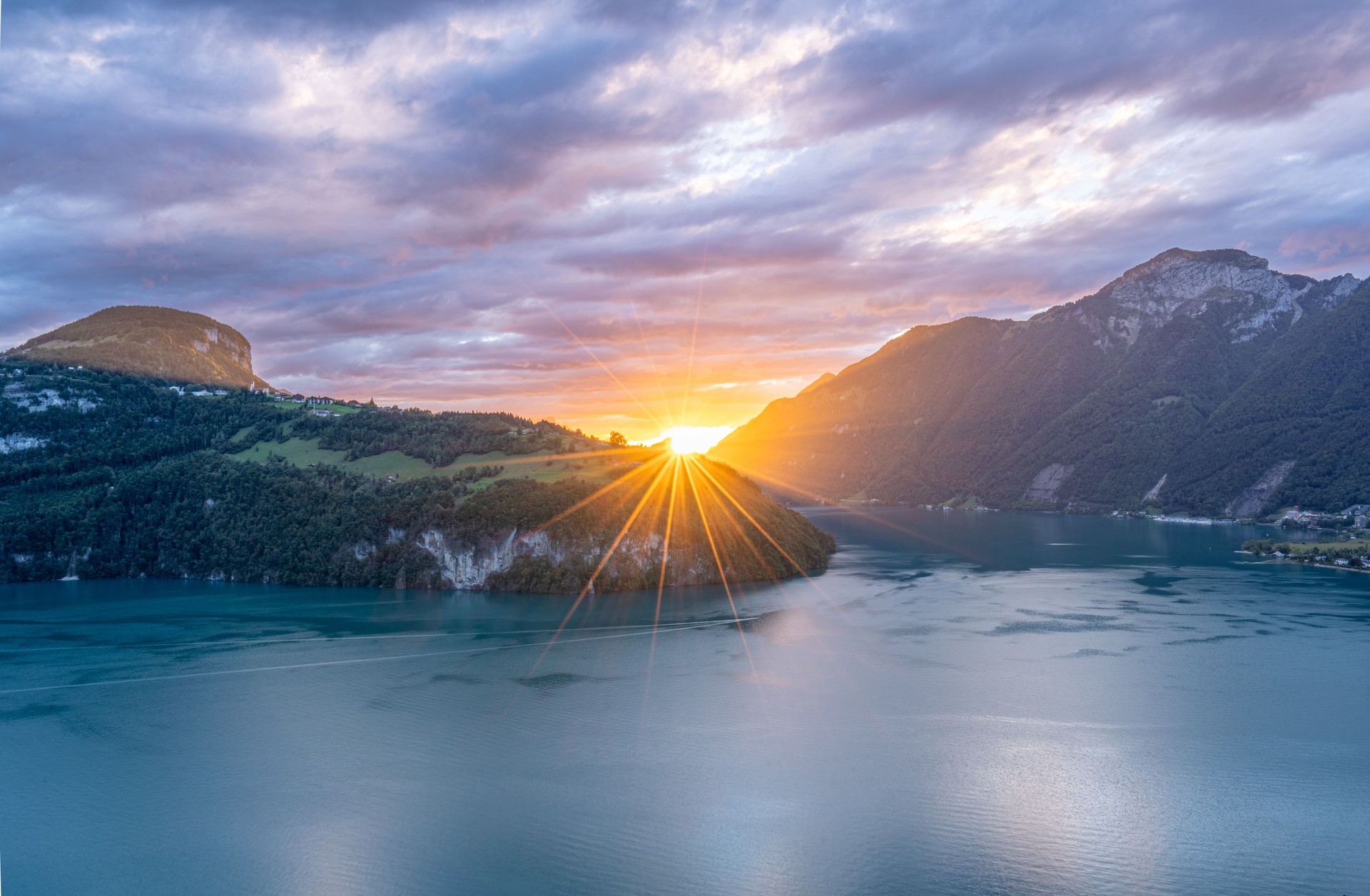 View from Morschach of a Vibrant Sunset & the Beautiful Swiss Alps Towering Over the Turquoise Blue Water of Lake Lucerne Switzerland